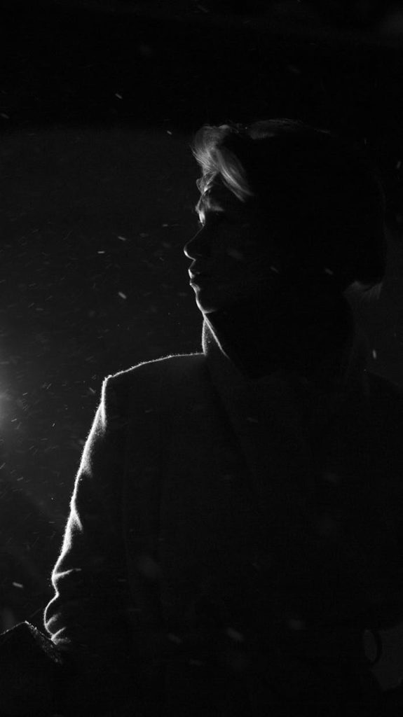 pexels-photo-22643631 Artistic black and white silhouette of a woman in the dark, exuding mystery.